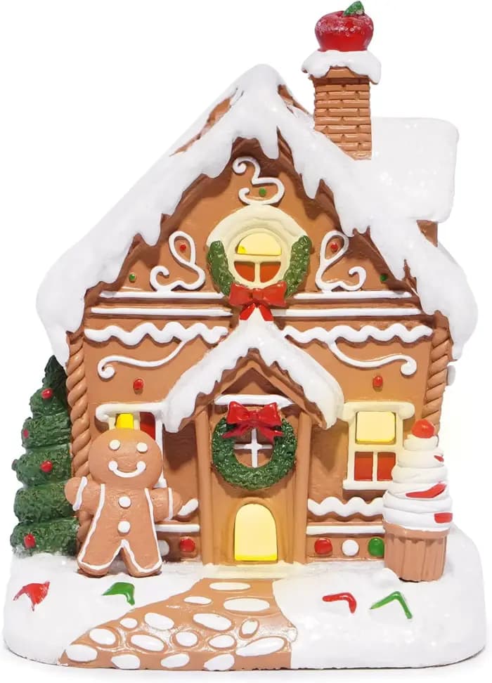 Décoration de maison en pain d'épice de Noël avec couronne de Noël, homme en pain d'épice et cheminé