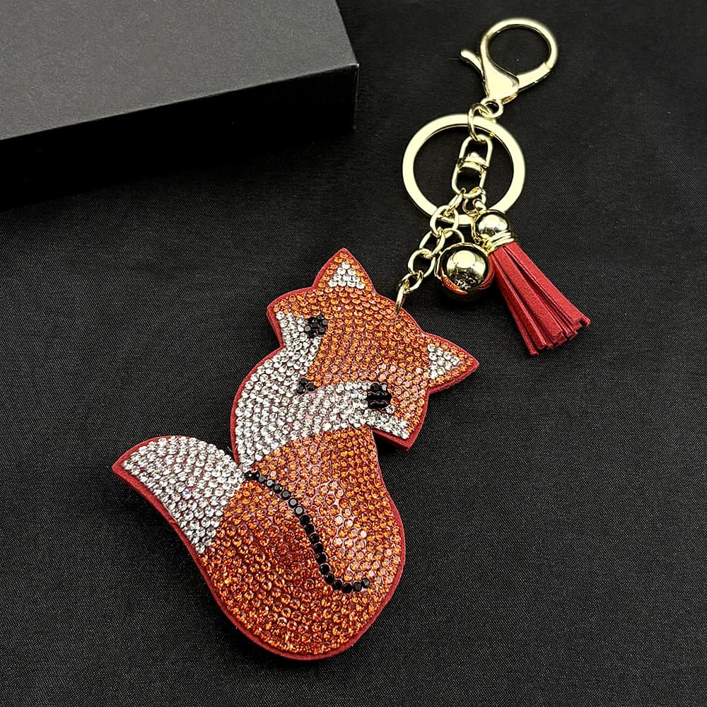Orange Fox Porte-clés tendance et sexy pour femmes et hommes, avec pompon et entièrement orné de cri