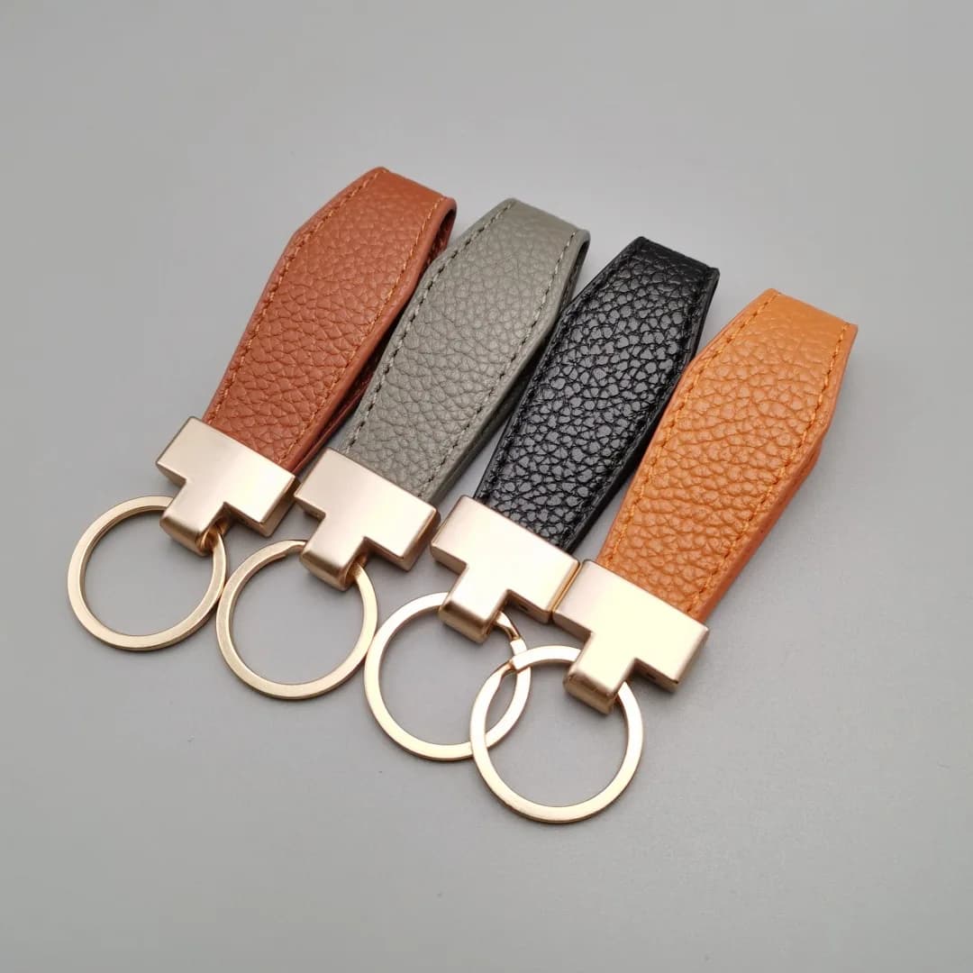 Porte-clés de luxe pour hommes et femmes, en cuir exquis, porte-clés de voiture, cadeau pour filles, accessoires masculins