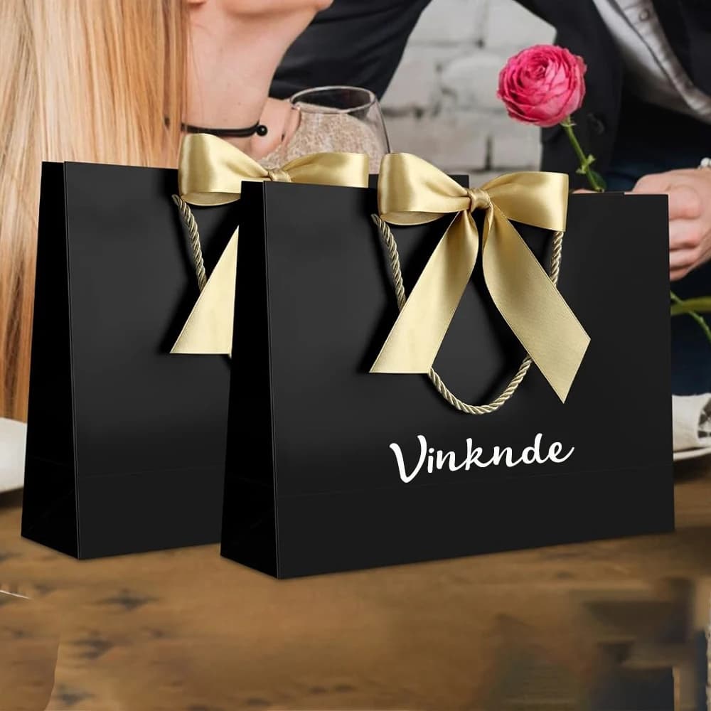 Sacs cadeaux blancs en vrac avec poignées