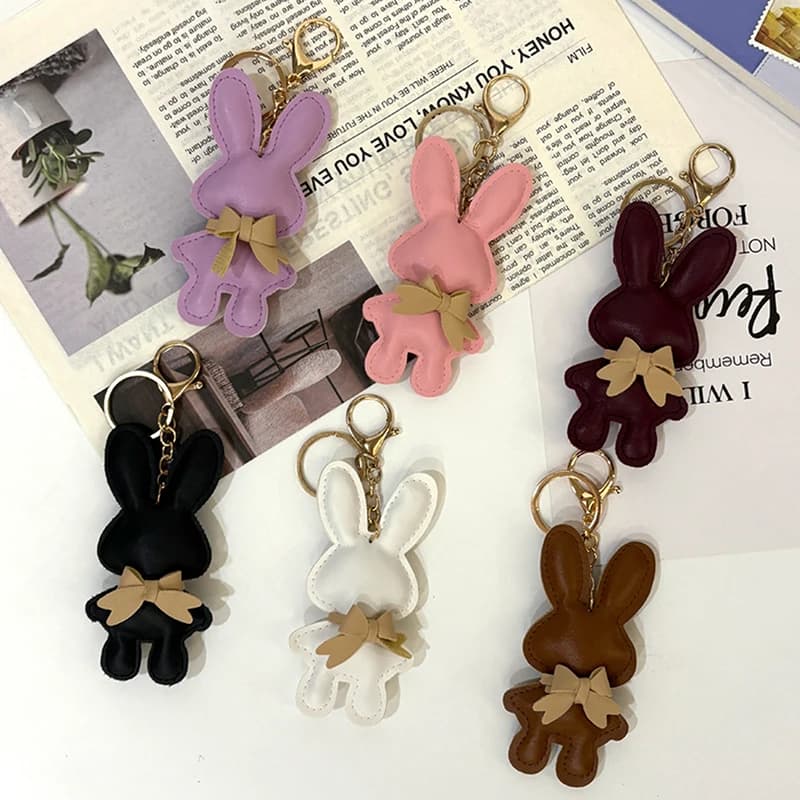Porte-clés lapin tendance en cuir PU ; Porte-clés lapin de couleur unie ; Porte-clés de voiture unique en forme d'arc ; Magnifiques accessoires de sac cadeaux