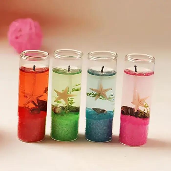 Bougie d'aromathérapie sans fumée en verre avec coquillages et détails floraux pour la décoration de maison romantique et de mariage