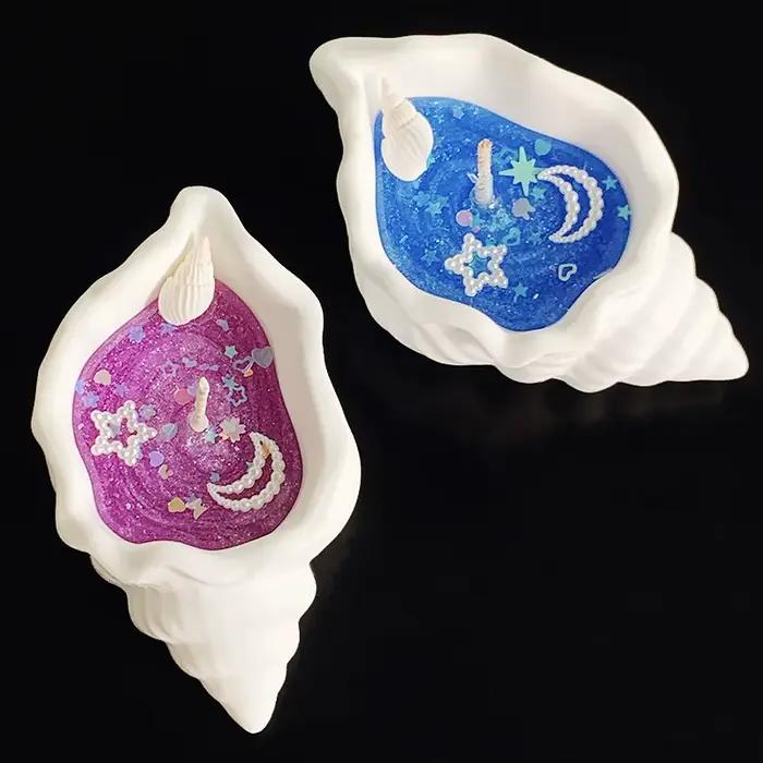 Bougie parfumée en forme de coquillage sur le thème de l'océan
