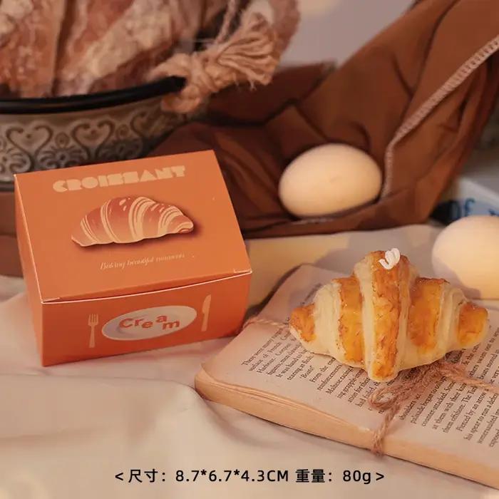 Bougie parfumée faite à la main en forme de pain factice avec parfum de gâteau