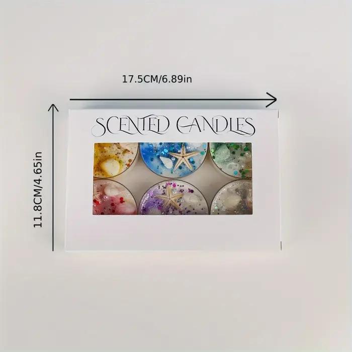 Coffret cadeau de bougies parfumées sur le thème des coquillages avec accents de perles et de paillettes